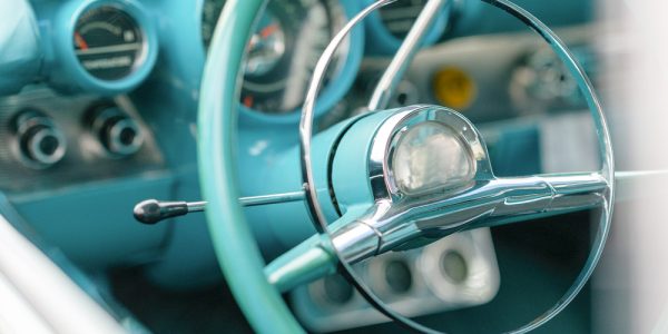 close-up-of-vintage-old-green-car-driver-s-wheel-2021-08-26-19-00-48-utc